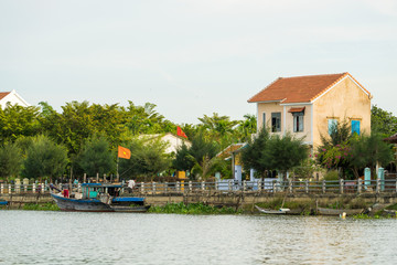 Fototapeta na wymiar Houses along the Thu Bon river near Hoi An