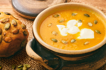 Pumpkin cream soup with ginger and pumpkin seeds.