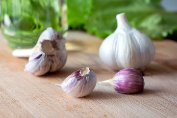 CloseUp fresh garlic on kitchen table. Healthy aroma dish ingredient