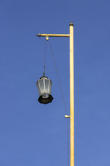 Lantern pole on the roof of chinese shrine with blue sky background.