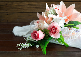 Bouquet of artificial flowers on white cloth beautiful,  Selective focus