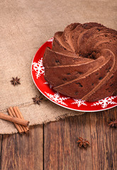 Traditional Christmas chocolate cake on wooden table