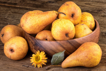 Ripe pears in farmhouse style on wooden table