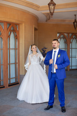 Fototapeta premium Newlyweds on a walk in the countryside