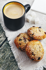 Cup of coffee and cookies with sesame seeds