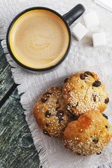 Cup of coffee and cookies with sesame seeds