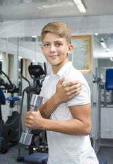 Teenage boy engaged in the gym hall