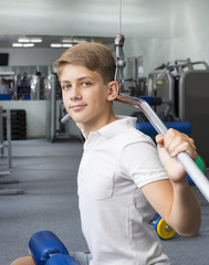 Teenage boy engaged in the gym hall