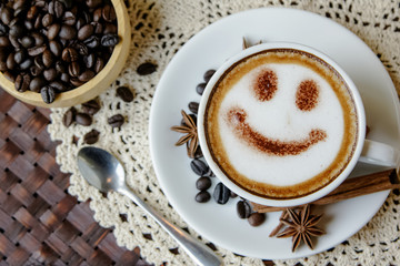 Top view white cup of latte art happy smile face