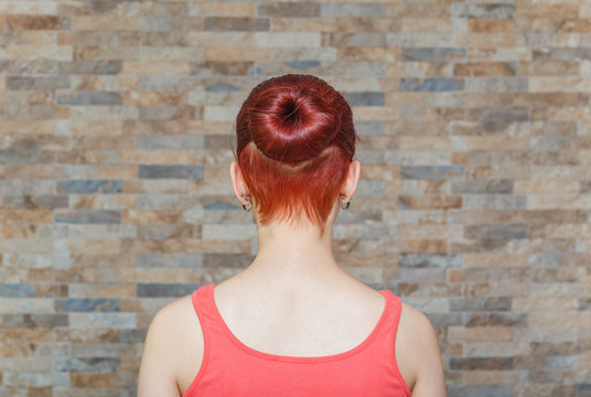 model with topknot and hidden undercut