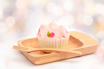 Steamed cup cake on blurred bokeh light background