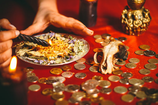 a witch holds a ritual for money