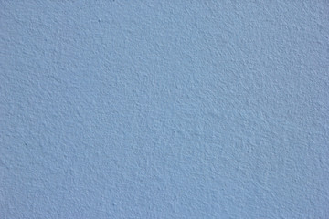 texture of blue rough plastered painted wall
