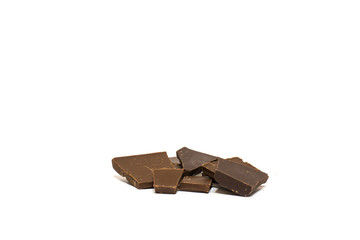 broken pieces of chocolate on white background