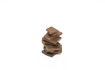 broken pieces of chocolate on white background