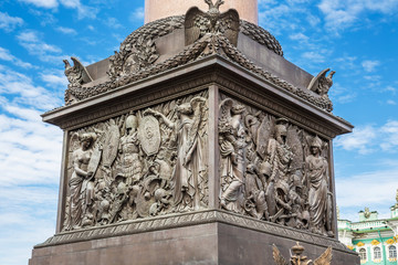 The pedestal of the Alexander Column on Palace Square in St. Petersburg decorated with symbols of...