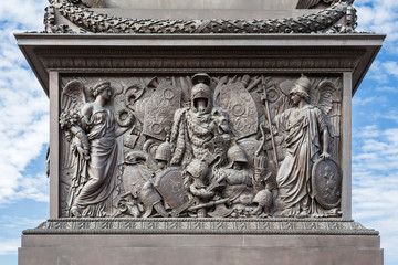 The pedestal of the Alexander Column on Palace Square in St. Petersburg decorated with symbols of military glory