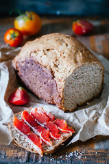 Homemade sandwich with salmon, home bread and tomato for breakfast
