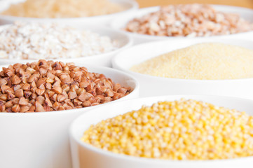 Different kinds of cereals: oats, millet, rice, buckwheat, wheat, spelt 