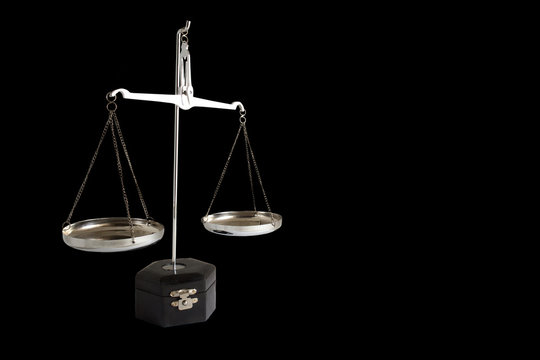Scale of Justice isolated on black background