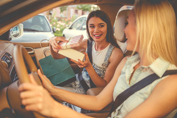 Girls shopping with the car