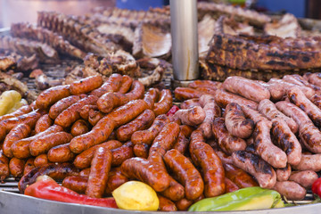 outdoor barbeque with sausages, sausages and peppers pork ribs