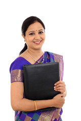 Obraz premium Happy traditional woman holding folder against white background