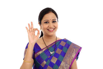 Traditional Indian Young woman making OK sign - 121381384