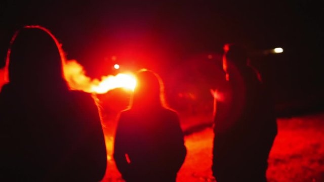 A Man Use Handfire Torch In Front Of Crowd Young People