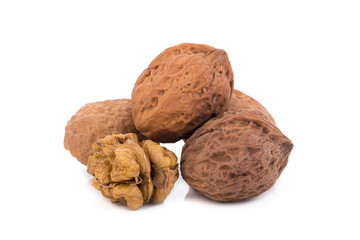 walnut and a cracked walnut isolated on the white background