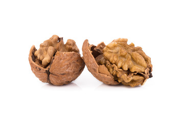 walnut and a cracked walnut isolated on the white background