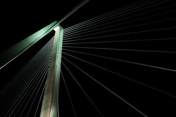 Fototapeta na wymiar Suspension Bridge at Lit Up at Night
