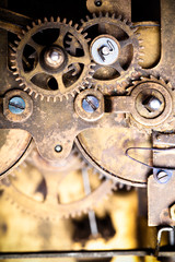 Old clockwork dirty with dust and lubricating oil. Selective foc