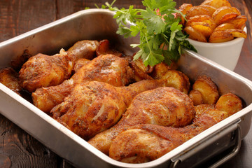Roasted chicken legs with potato chips