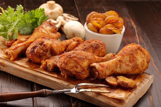 Roasted chicken legs with potato chips