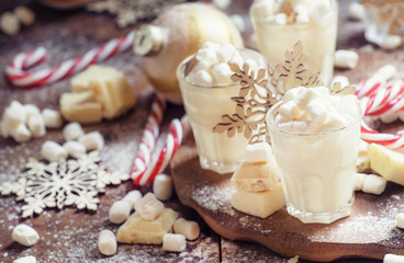 Hot white chocolate with marshmallows in a xmas decoration with