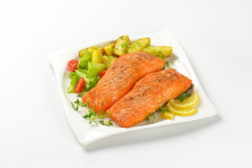 dish of salmon fillets with roasted potatoes
