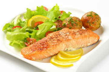 salmon fillet with roasted potatoes and fresh vegetables