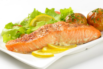salmon fillet with roasted potatoes and fresh vegetables