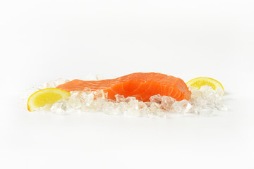 raw salmon fillet on ice