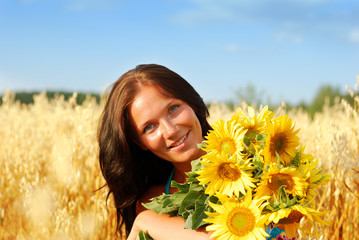 Young woman with sunflowers