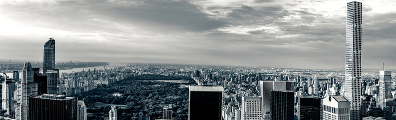 Panorama cityscape view on Central Park, New York, seen from the Rockefeller building "Top of the Rocks" before summer sunset.