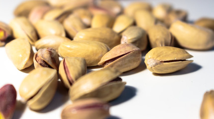Isolated shelled peanuts on a white background.