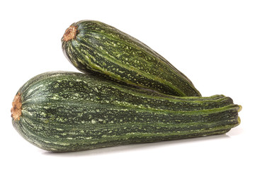 Two green zucchini isolated on white background