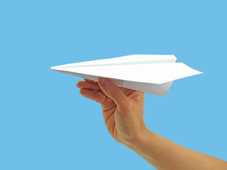 Paper plane in woman hand.