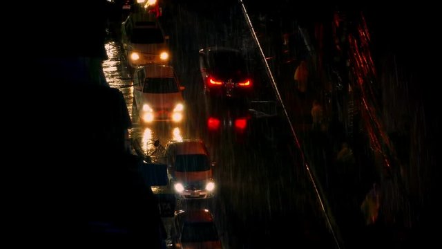 People And Cars In Heavy Rain