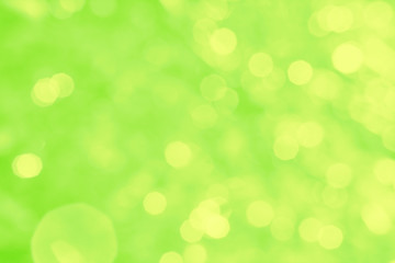 Obraz premium Abstract green background with yellow bokeh