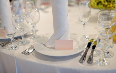 Beautiful wedding restaurant for marriage. White decor for bride and groom. Colorful decoration for celebration. Beauty bridal interior. Bouquet, food and flowers in hall