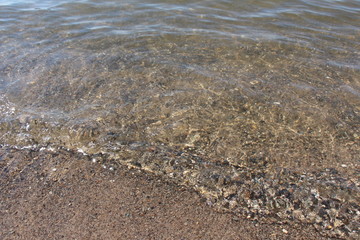 Wave of the sea on the sand beach