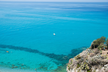 Fototapeta na wymiar Crystal clear sea near the town of Tropea region Calabria - Italy